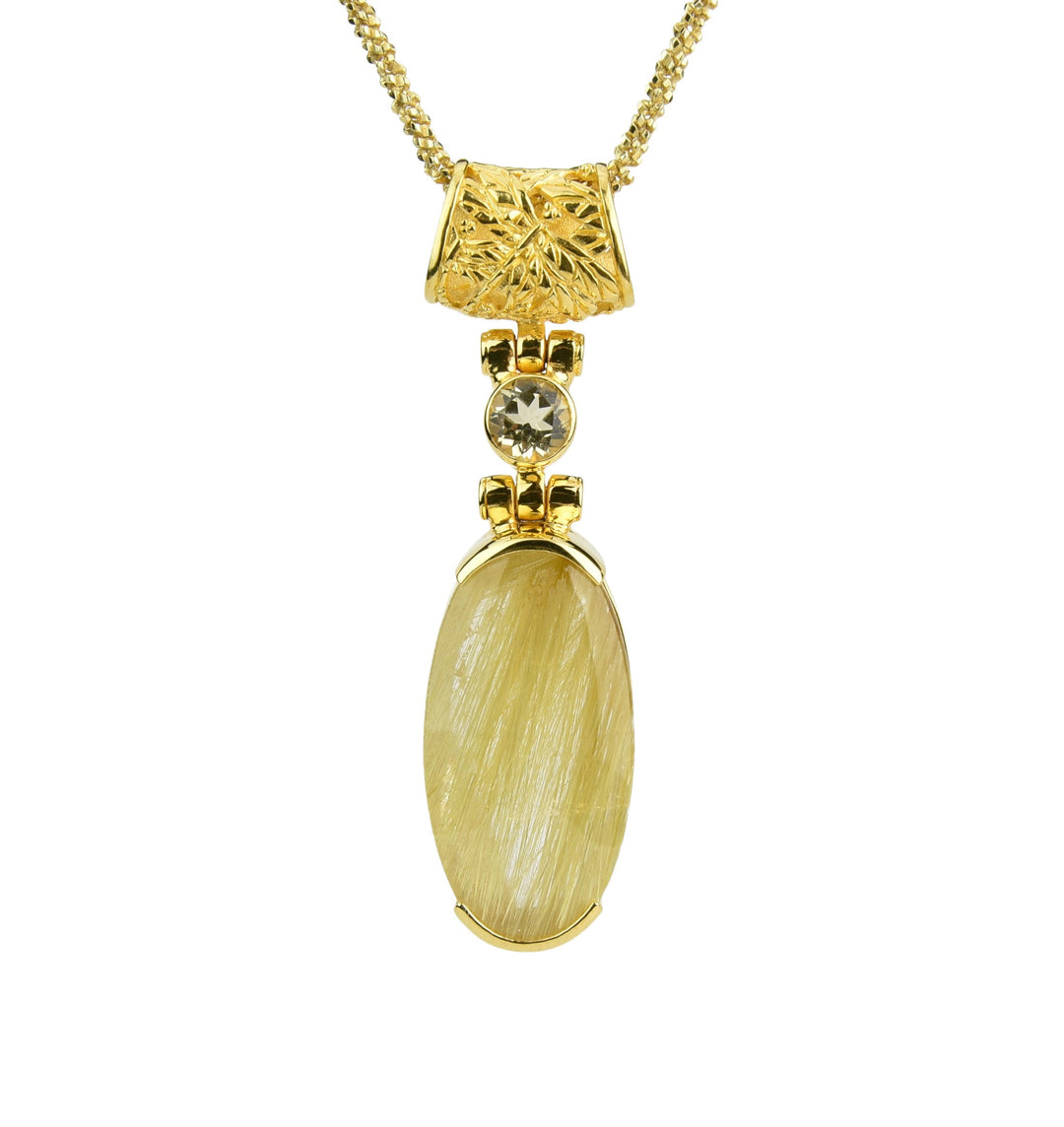 Golden Rutilated Quartz crystal gemstone pendant with oval stone featuring golden rutile strands and round accent in gold setting