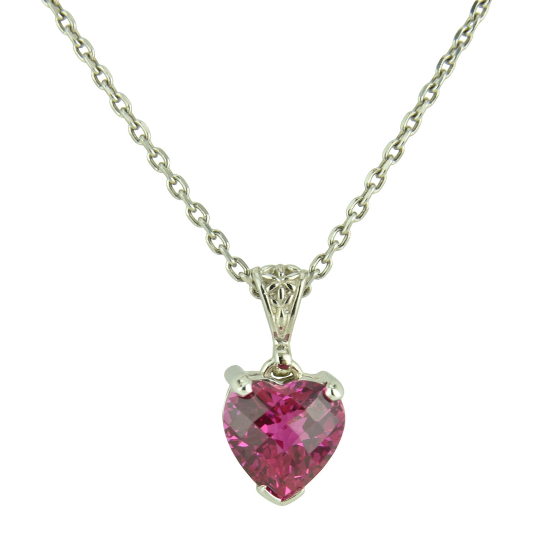 Parvati Sapphire crystal gemstone pendant with a heart-shaped pink stone set in silver, symbolizing love, devotion, and divine feminine energy.