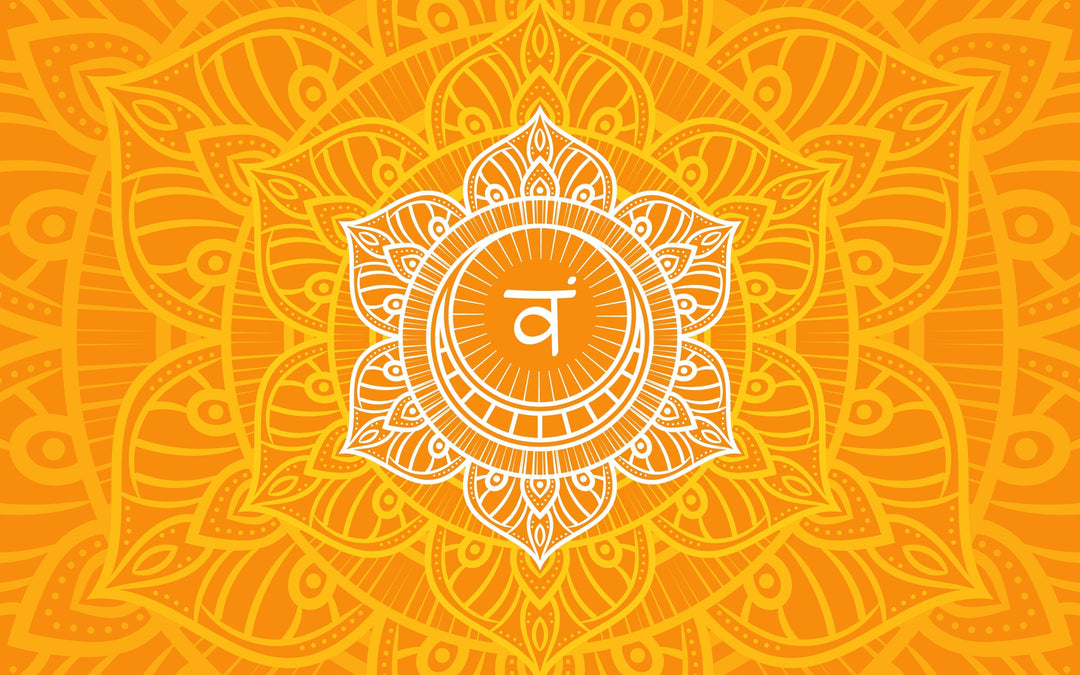 Sacral chakra symbol in the colour orange with mandala design, representing sacral chakra crystals like orange calcite and tiger's eye, and essential oils for creative energy.