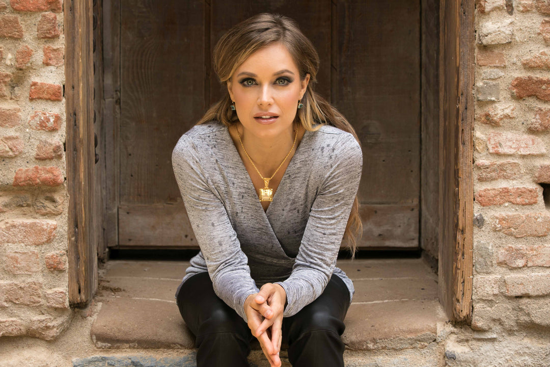 Model wearing a Kate King gemstone pendant necklace in gold for styling and size inspiration