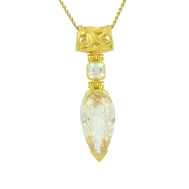 Pear Cut White Sapphire Pendant, set in Sterling Silver plated in Yellow Gold