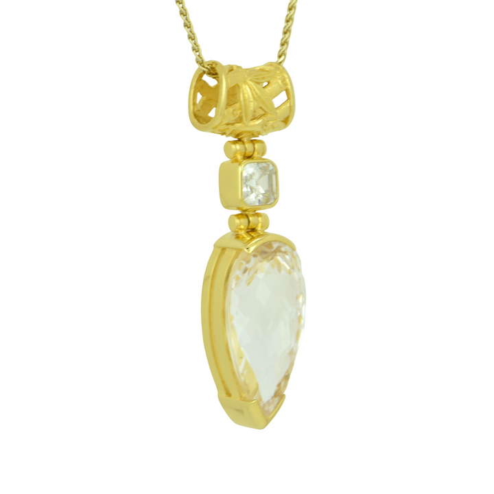 Pear Cut White Sapphire Pendant, set in Sterling Silver plated in Yellow Gold