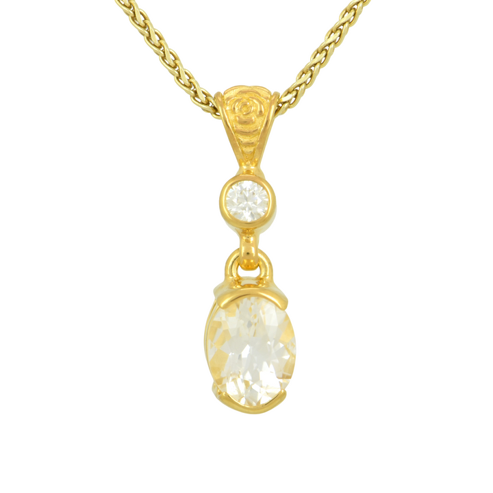 Phenakite Pendant, Oval Cut, set in Sterling Silver plated in Yellow Gold
