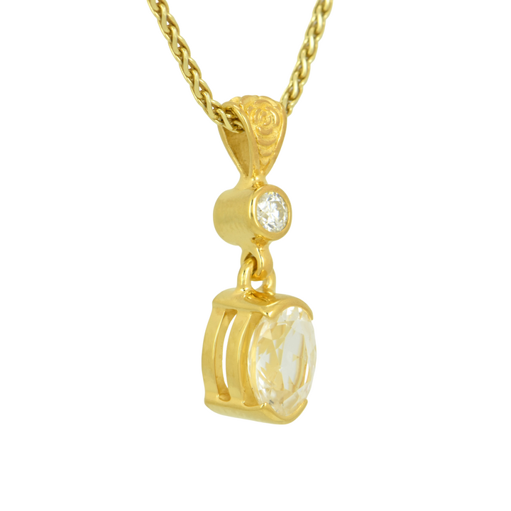 Phenakite Pendant, Oval Cut, set in Sterling Silver plated in Yellow Gold