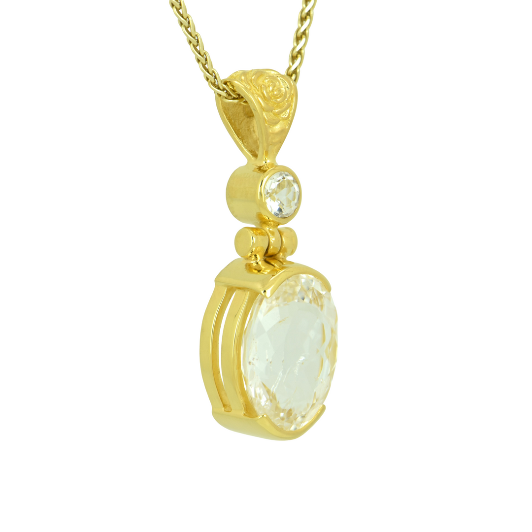 Phenakite Pendant, Oval Cut, set in Sterling Silver plated in Yellow Gold