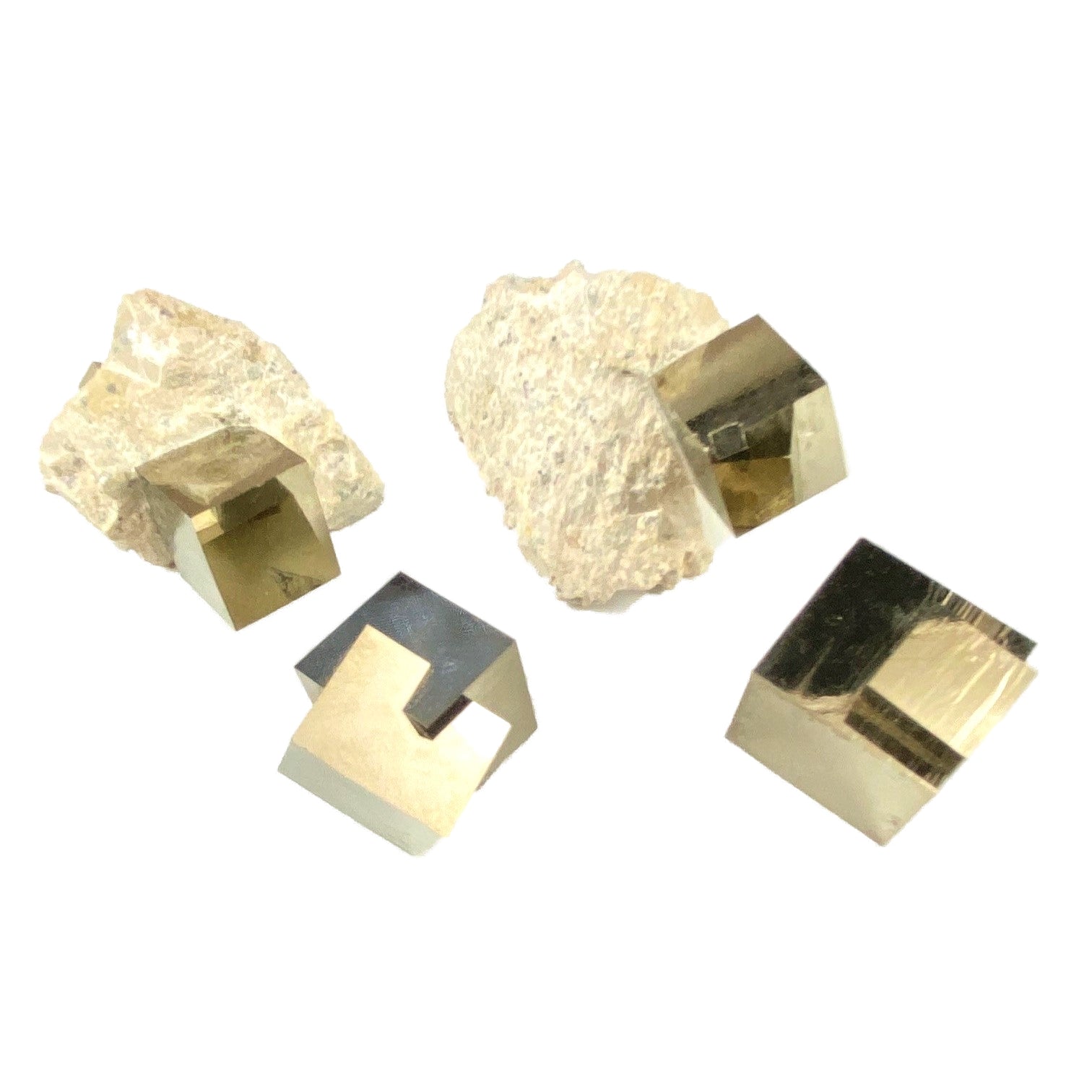Raw and polished pyrite crystals known as fool’s gold with metallic gold shine