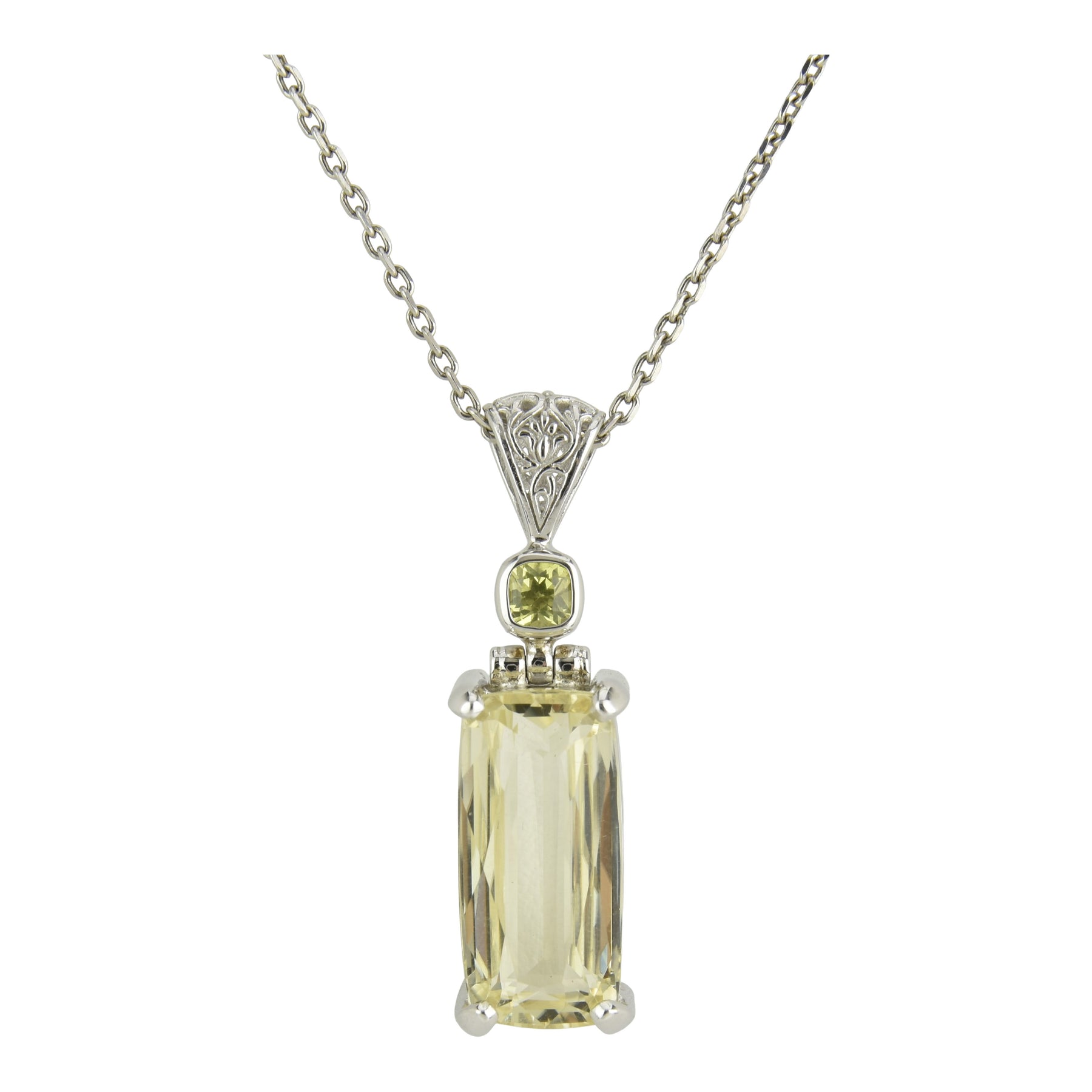 Spodumene crystal pendant with gentle golden hue, a nurturing stone that promotes self expression, higher wisdom, and light codes for new beginnings, prosperity, and emotional healing